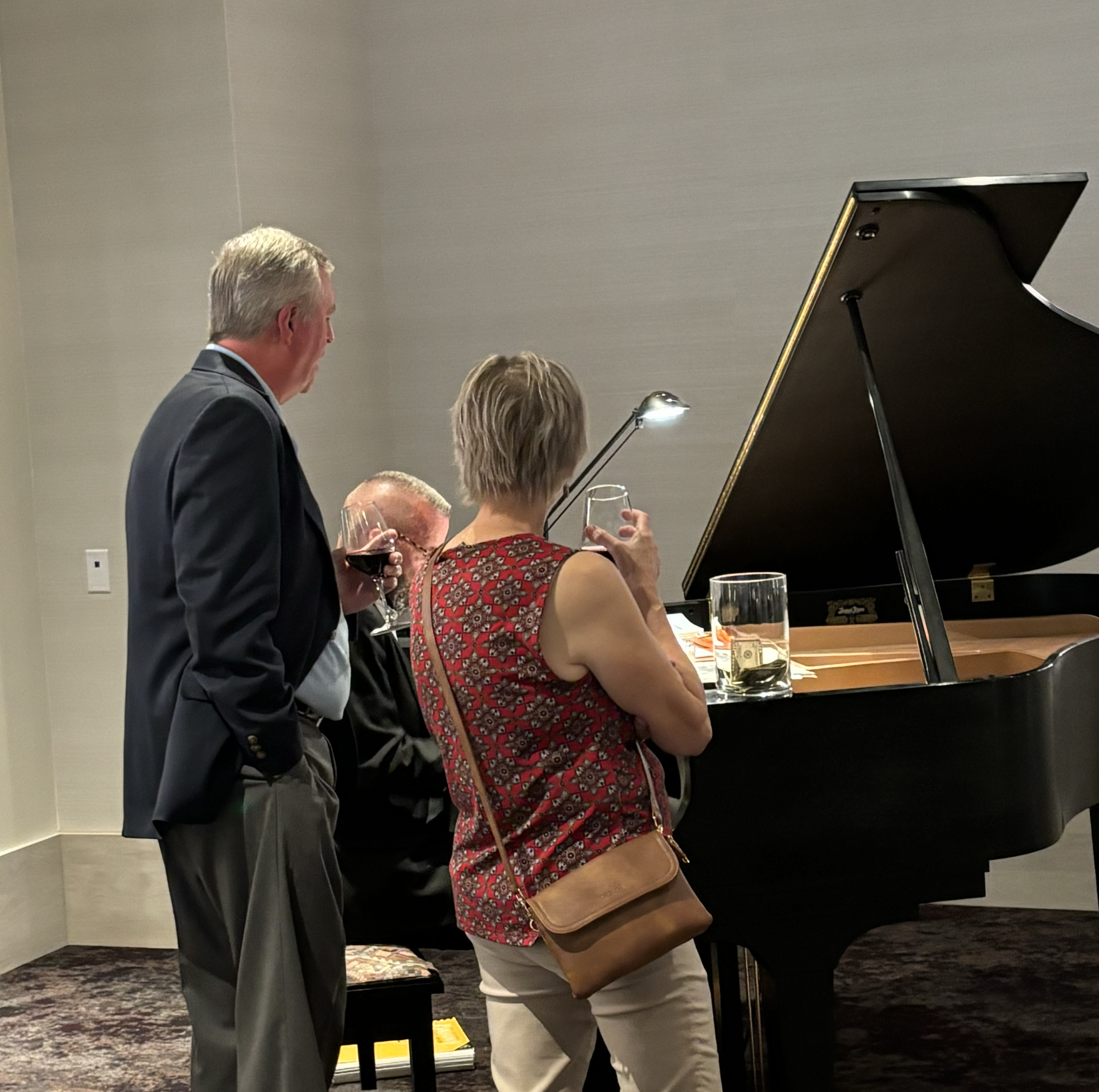 Singing at the piano with Jeff Shoemaker '73