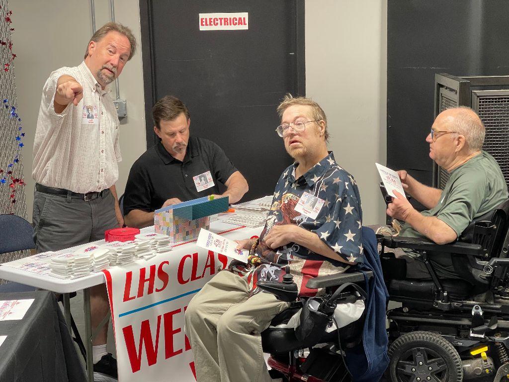 Tom Duin (center) and Bill Klein check in with Jeff Tornow and Scott Thien on June 9, 2023, at the South Dakota Military Alliance.