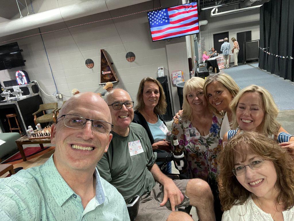 Bill Sevold and Bill Klein are joined by their harem (from left): Elizabeth Rupp, Deb (Sandberg) Lee, Lori (Denevan) Johnson, Jeannie Collins and Sheryl (Grosz) Hillberg on June 9, 2023, at the South Dakota Military Alliance.
