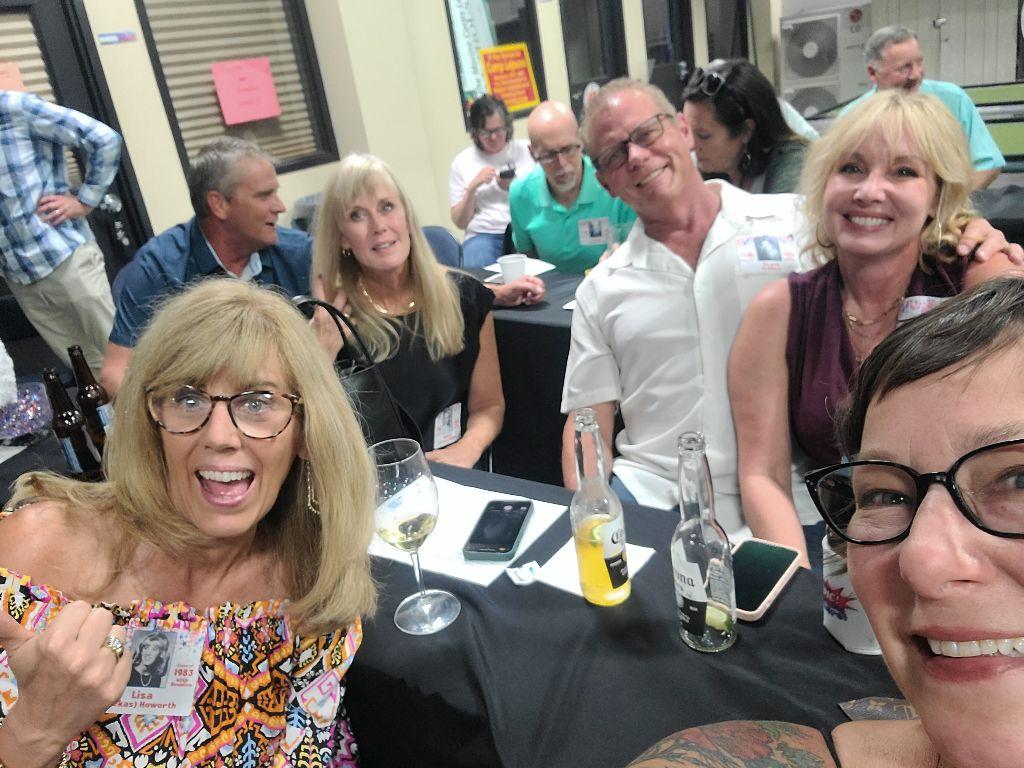 From left: Lisa (Pekas) Howorth, Steve Zoellner (Class of 1984), Nancy (Howes) Robson, Scott Zoellner and his wife, Conni, and Heidi Souza were all smiles on June 9, 2023, at the South Dakota Military Alliance.