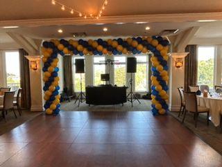 The DJ at the head of the Dance Floor.... framed with balloons.