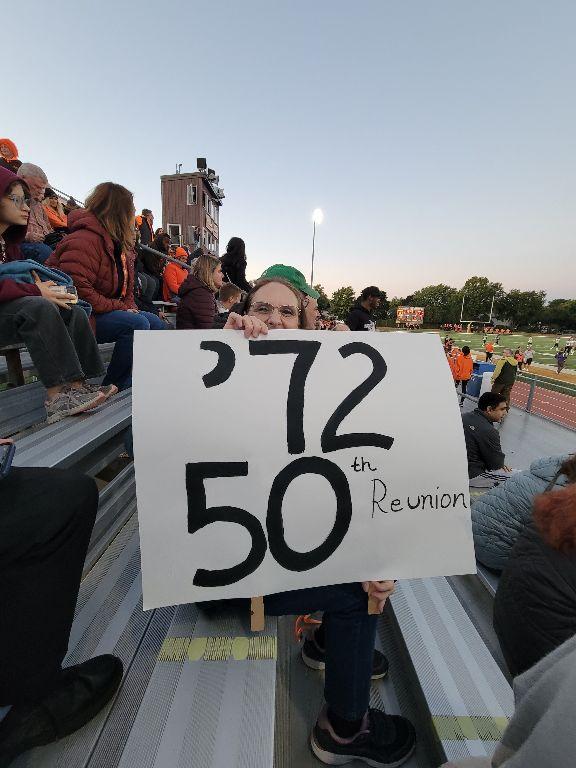 50th Reunion - Gathering Sign at Homecoming Game (sign held by Kathy Laier Olson)