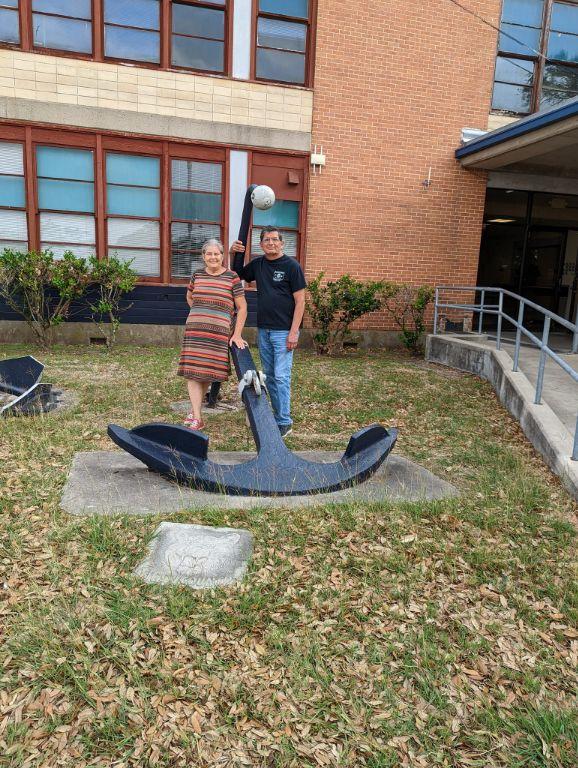 Teri Stockton Ramirez & Daniel Ramirez posing in front of the Anchor and in front of Carroll where they met. 