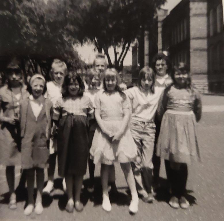 Whittier 5th grade. Kathy Mercer on right, Lydia Rodriguez left, April Harris in middle of back row, & Mona (?) next to April.