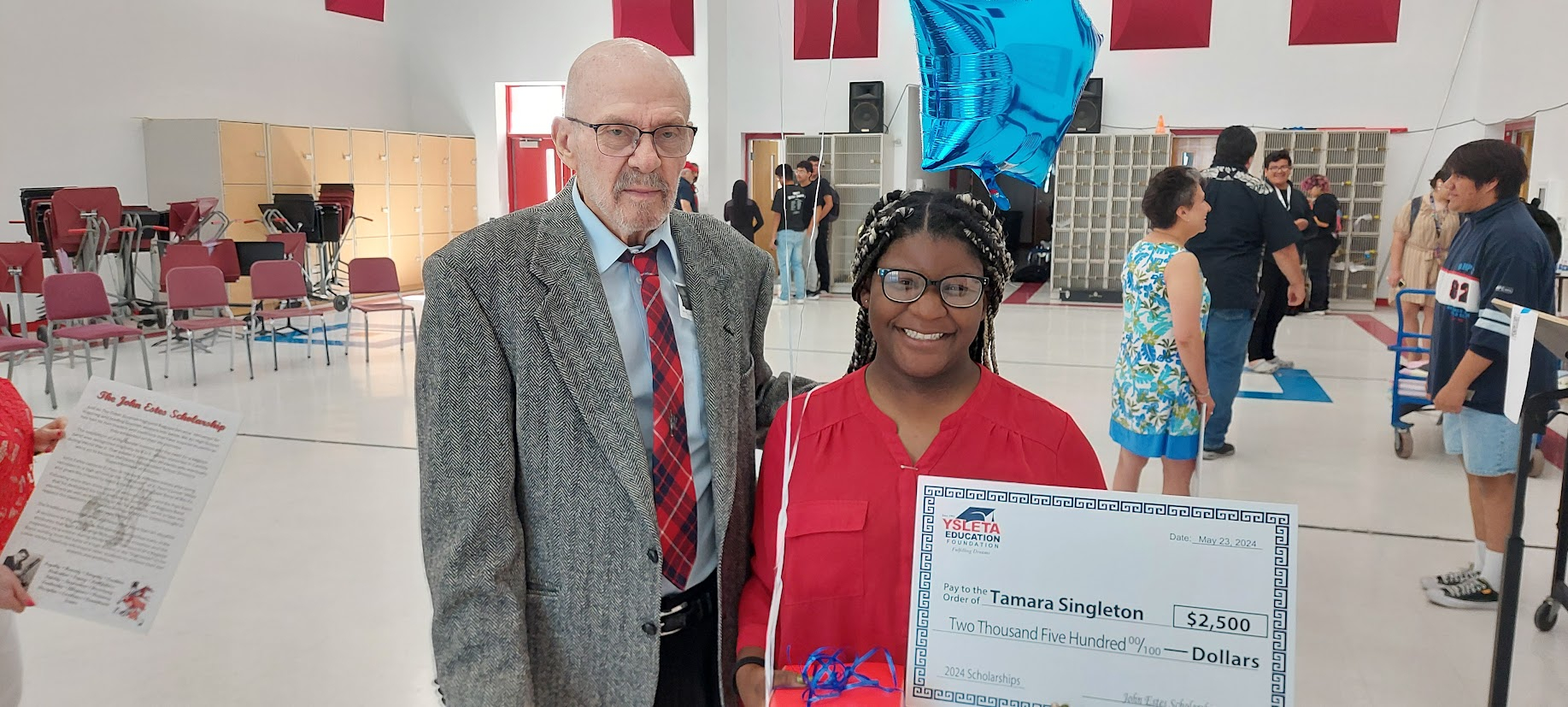 John Estes presenting the first John Estes Scholarship to Tamara Singleton 